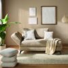 Global Wohnen Schlafsofa Beluso in Stoff grau-beige mit schwarzen Metallfüßen im Wohnzimmer